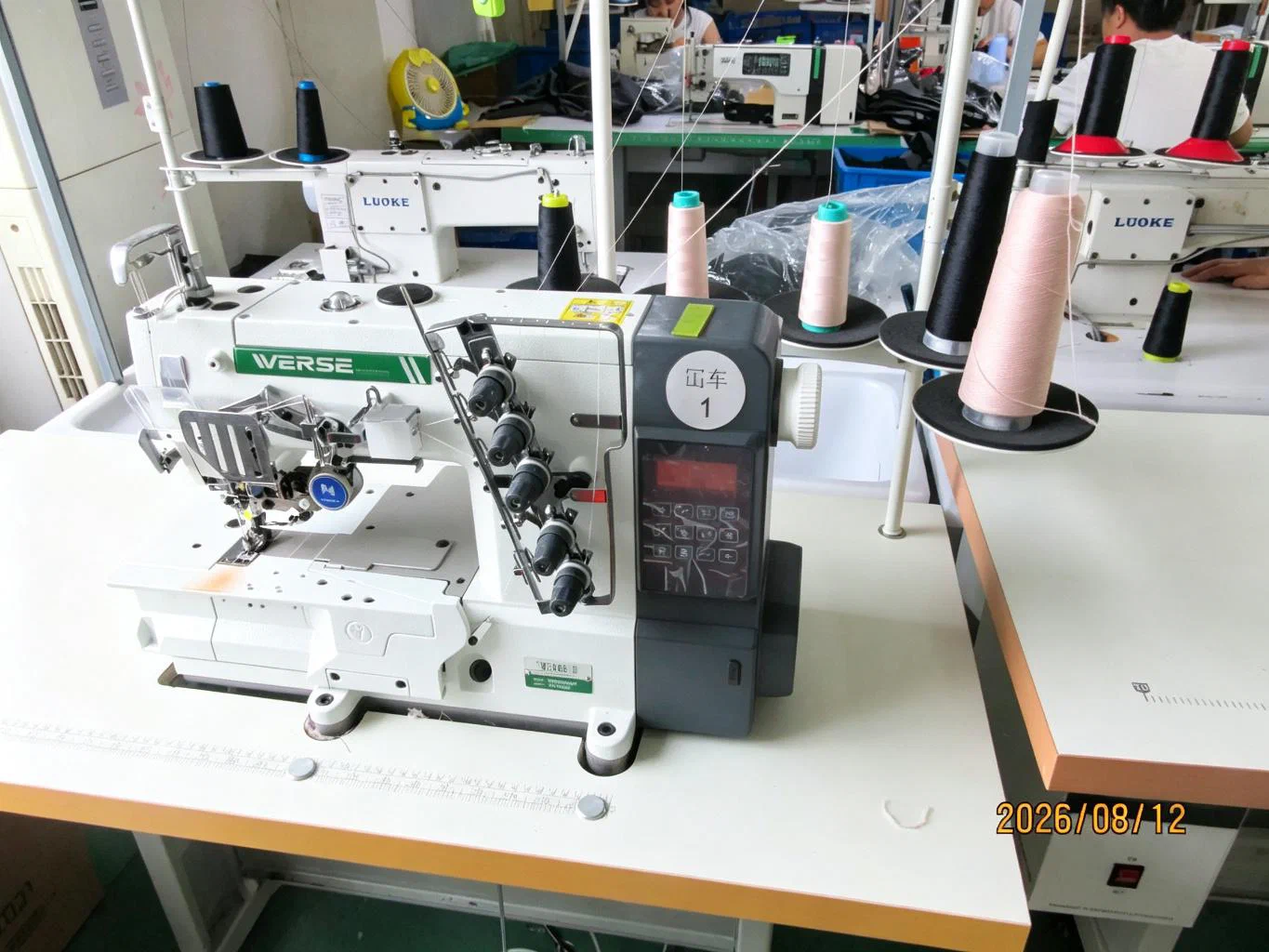 Industrial sewing machine for garment production